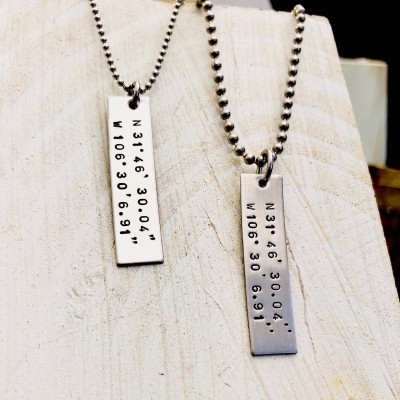 His and hers coordinates necklaces .